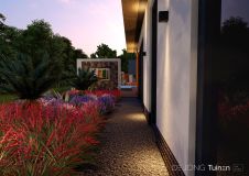 Tuinontwerp zijtuin met bloeiende beplanting en palmbomen