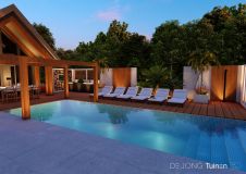 Villatuin met op maat gemaakte wand Ibiza sfeer