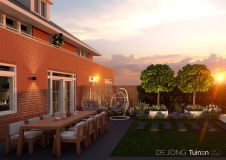 Strakke tuin met witte plantenbakken in Papendrecht