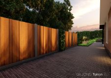 Strakke tuinafscheiding in combinatie met gebakken klinkers